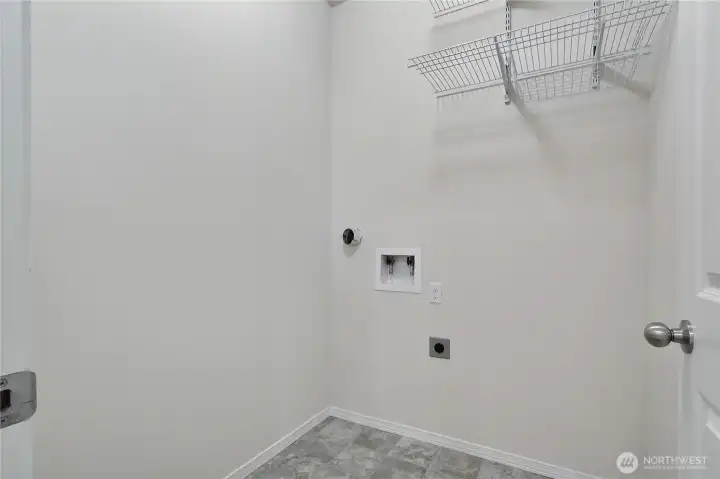 Laundry room with storage.