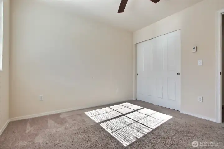 Second bedroom with natural lighting.