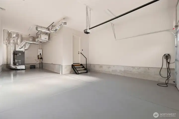 3-car tandem garage with Navien tankless water heater and wired for 2 EV chargers.