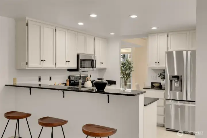 Kitchen is bright with extra bar seating