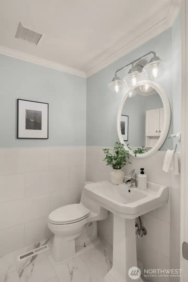 Powder room on main is beautifully updated