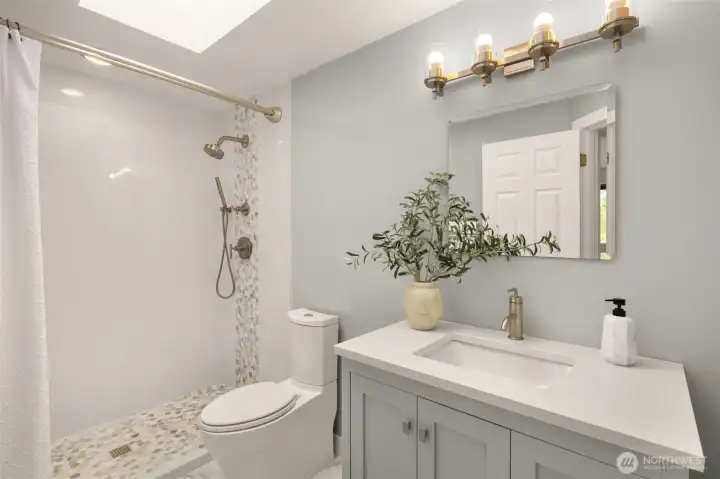Upstairs hall bath is also beautifully updated