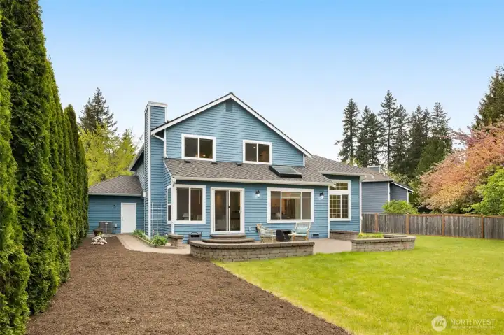 beautifully landscaped yard with endless possibilities for entertaining, play, or simply relaxing in your own private retreat
