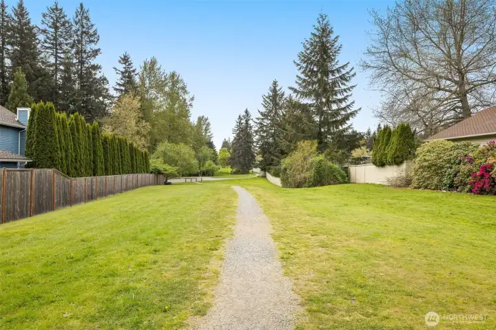 Trail to the right of the house. With no neighbors to the right, this property offers very rare privacy, in addition to close proximity to Yellow Lake and Lakeside Pool & Park