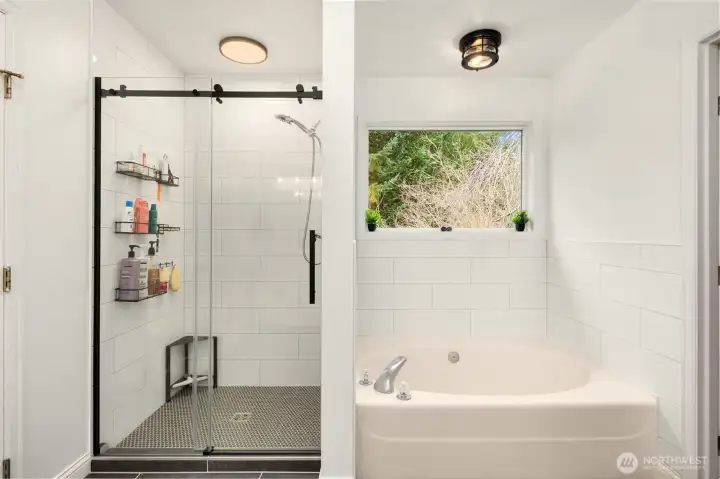 Primary bath with soaking tub and separate shower.