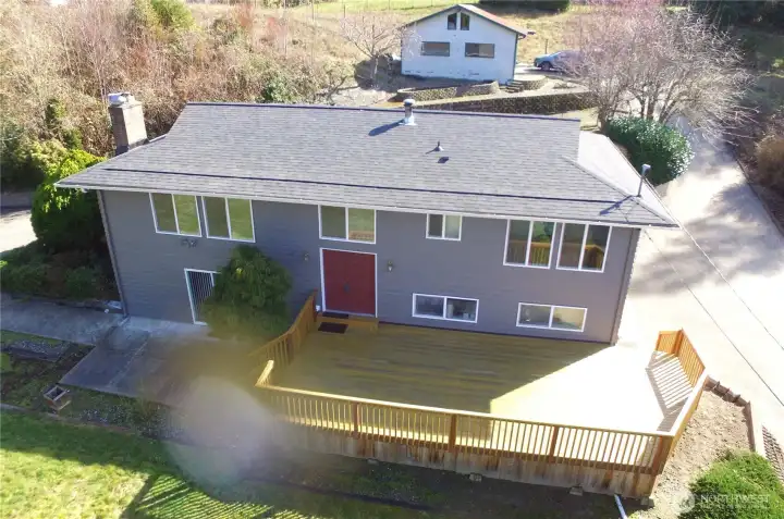 Front of house, deck and detached garage/shop