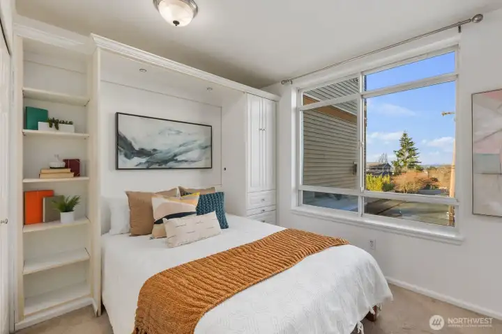 built-in shelving, cabinet & drawers, plus additional closet on left