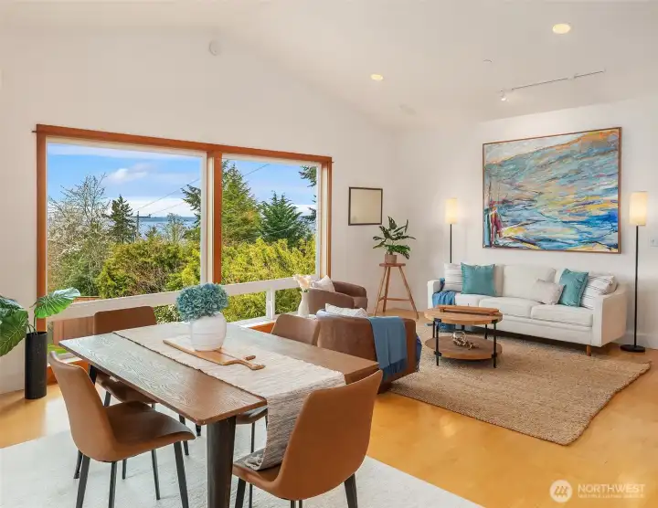 Great room with vaulted ceilings, real hardwood maple floors, clear vertical fir trim and compelling views of Seattle, sound, Blake Island, ferries plying the sound and Olympic Mountains. On a clear day you can see Mount Baker!