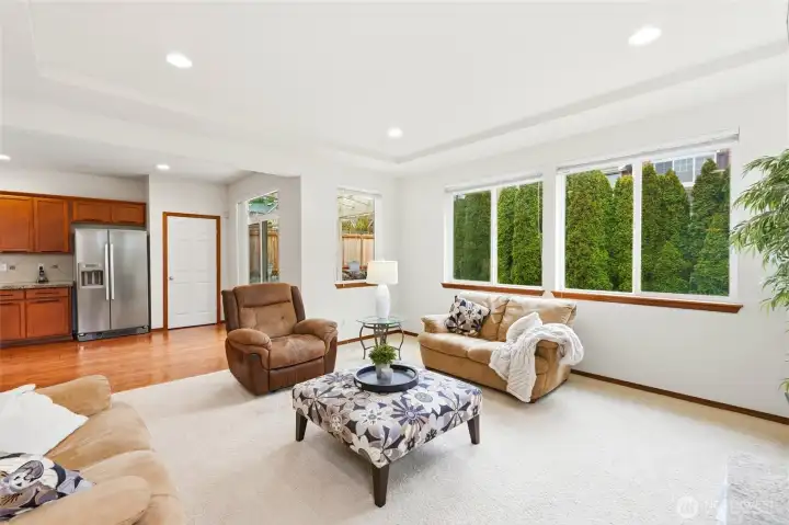 Beyond the great room is the breakfast nook and kitchen and hardwood floors that run the length of the home.