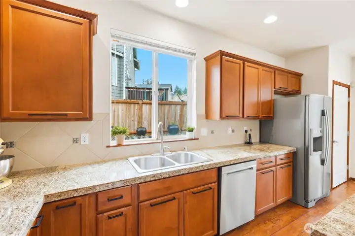 Morning sun streams through the east facing kitchen window ~ perfect for viewing your garden space or flower pots.