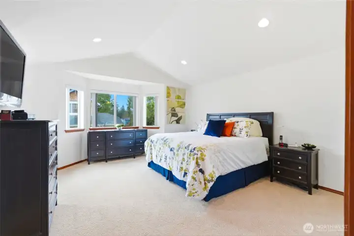 Enter the Primary suite with vaulted ceilings and so much space!