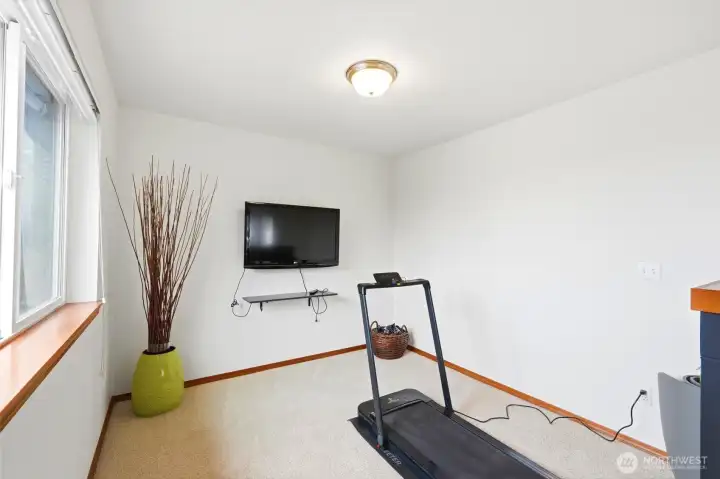 Primary sitting area could be used as an exercise space or quiet sitting room. How would you use this space?