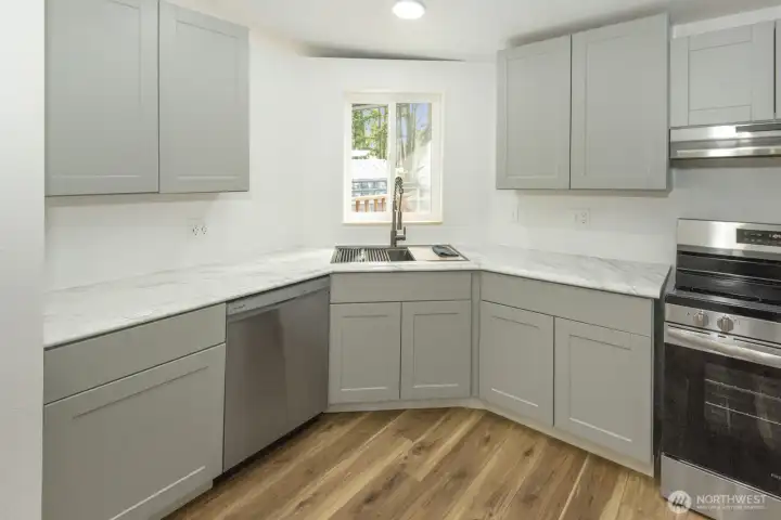 Fully updated kitchen with brand new cabinets, counters, and appliances