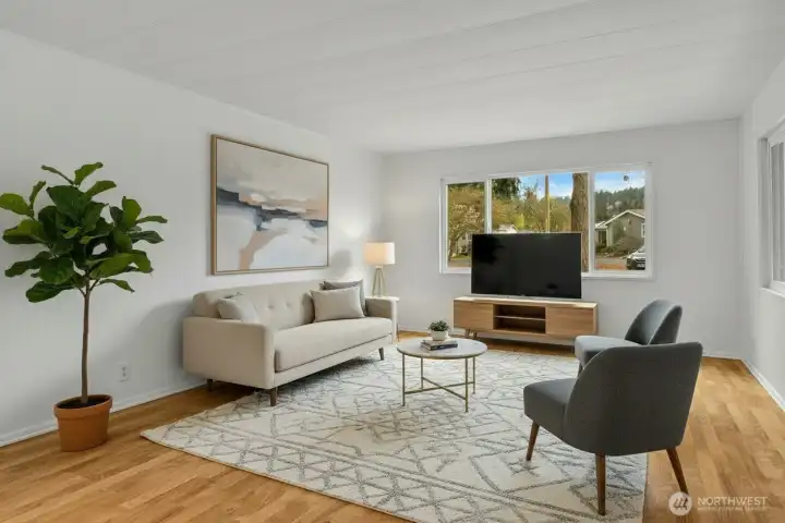 With plenty of natural light and a open concept feel- this living room is warm and inviting and the place you will want to spend time in! *Virtually staged