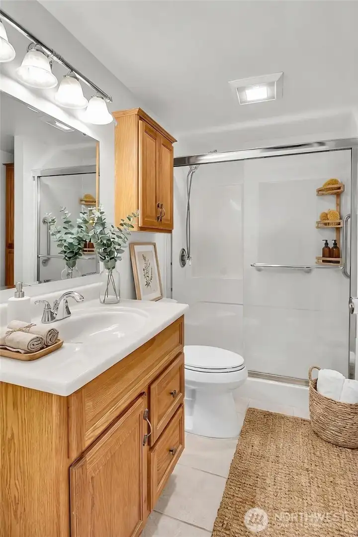 Primary bath can be accessed from both the hall and the primary bedroom. *Virtually staged