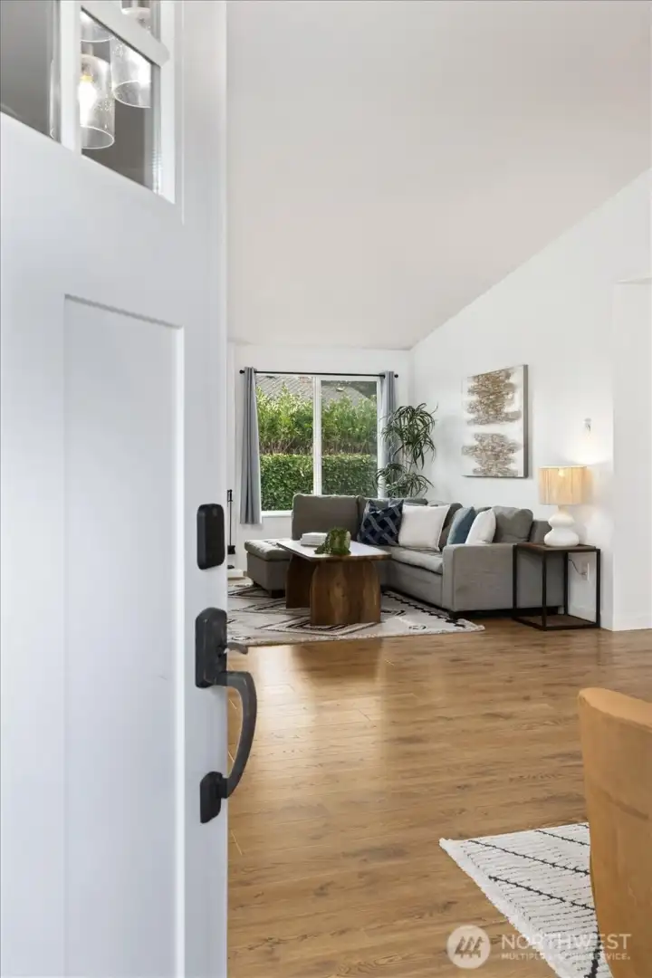 Enter into a great space with vaulted ceilings and a cozy fireplace.