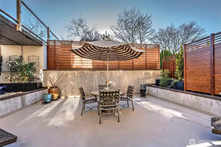 Spacious private patio flooded with Southern exposure provides a wonderful extension of living space for al fresco dining, relaxing and gardening.