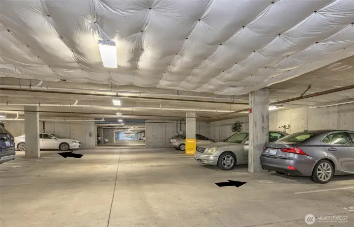 Two garage parking spaces and extra storage convey with sale.