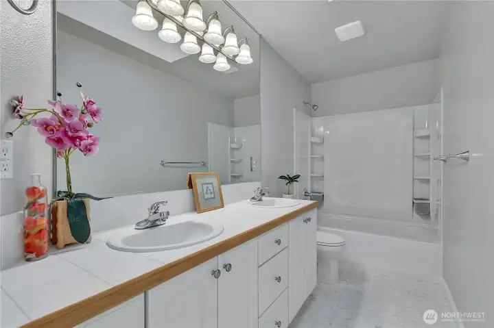 The spacious upstairs full bath, with dual sinks.