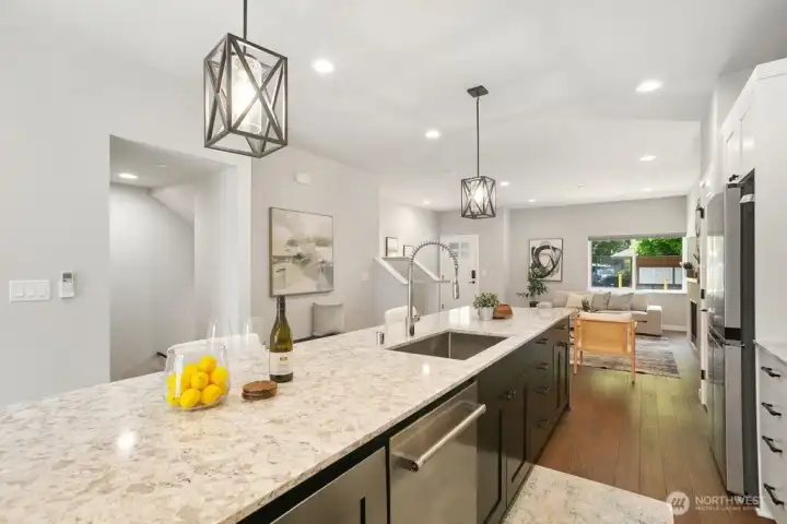 Oversized Island with Quartz counters, modern cabinets and a great flow to cook, entertain and host large or small gatherings.
