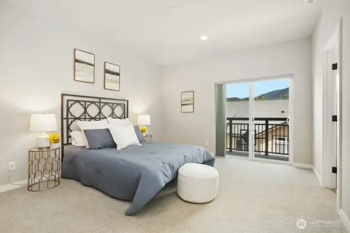 Picture of the master suite with a private balcony with gorgeous  views of the mountains.  Fresh paint, nice size walk in closet and a deluxe master bath completes this private suite that sits on one side of the home.