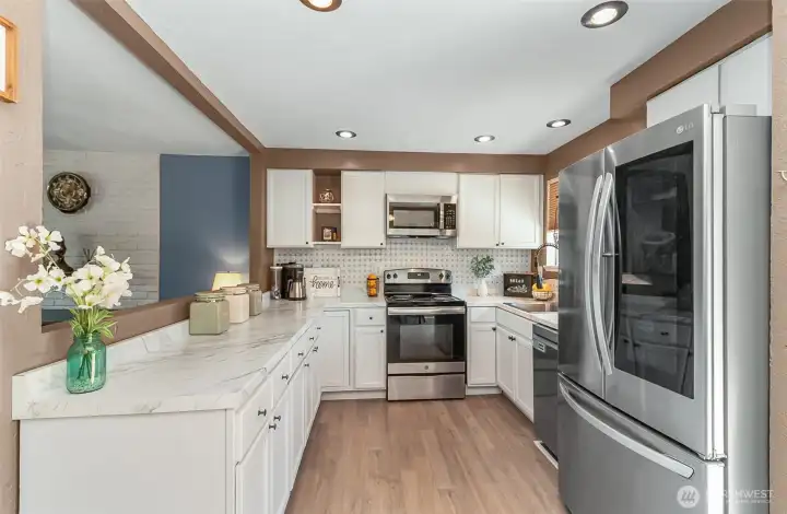 Open kitchen with lots of cabinets and counter space