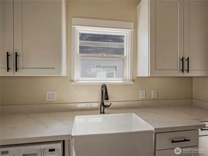 New cabinets, counters, farm sink and dishwasher