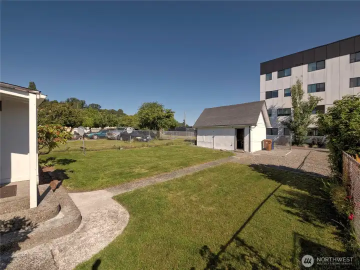 Backyard, garage/shop and gravel parking