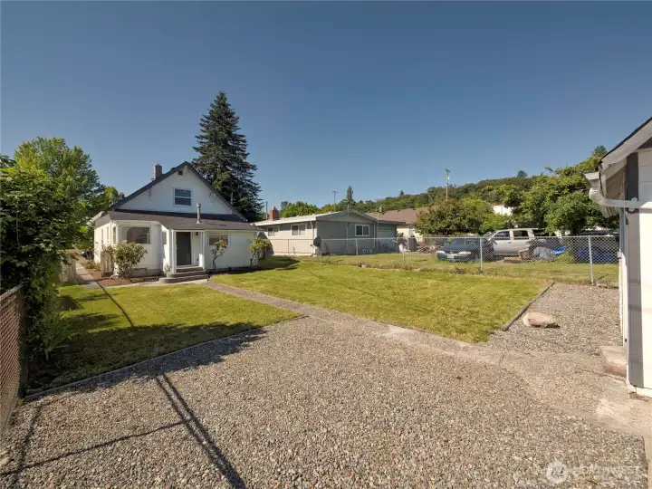 Backyard from the gravel parking area