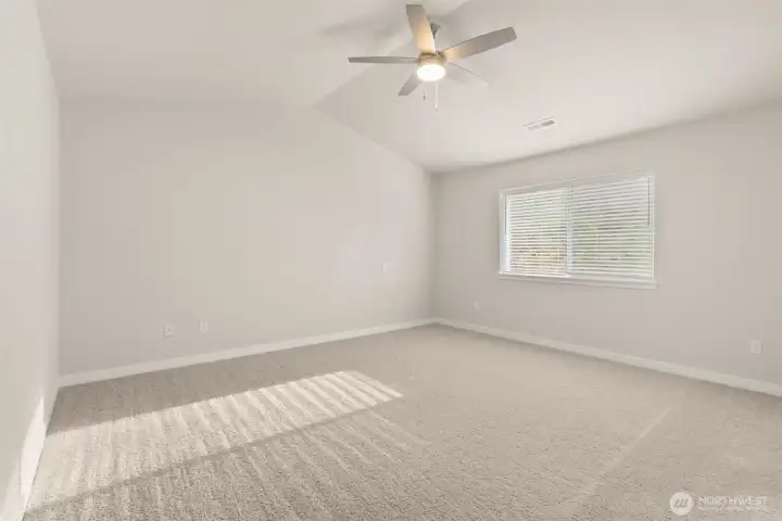 Primary Bedroom with ceiling fan for those warm days. Primary Bedroom with ceiling fan for those warm days.