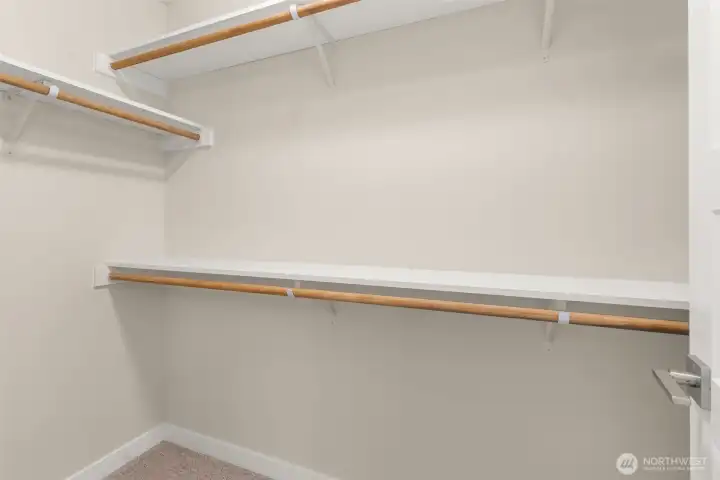 Large Primary walk in closet. Large Primary walk in closet.