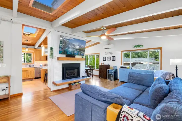 Upon entry to the great room, warm wood tones envelop from floor to vaulted ceiling. Upon entry to the great room, warm wood tones envelop from floor to vaulted ceiling.