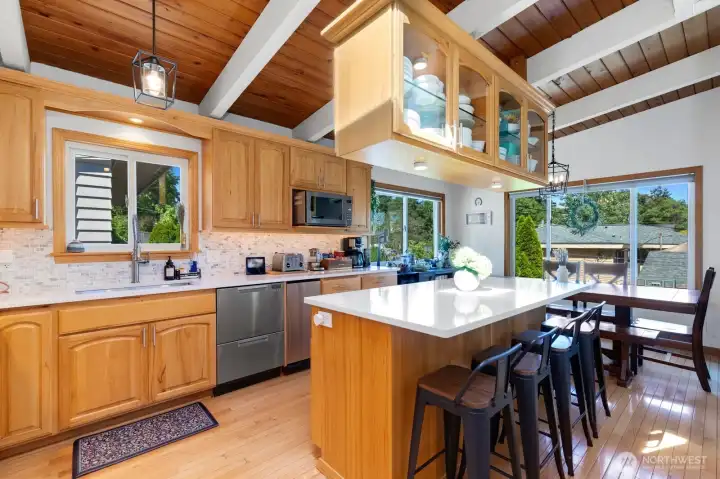 Pull up a chair at the kitchen island to socialize with the chef. Plenty of storage for all the gadgets and goodies here. Pull up a chair at the kitchen island to socialize with the chef. Plenty of storage for all the gadgets and goodies here.