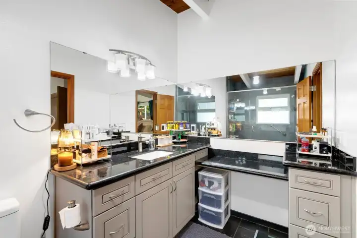 Primary bath features a separate vanity station and bonus storage. Primary bath features a separate vanity station and bonus storage.