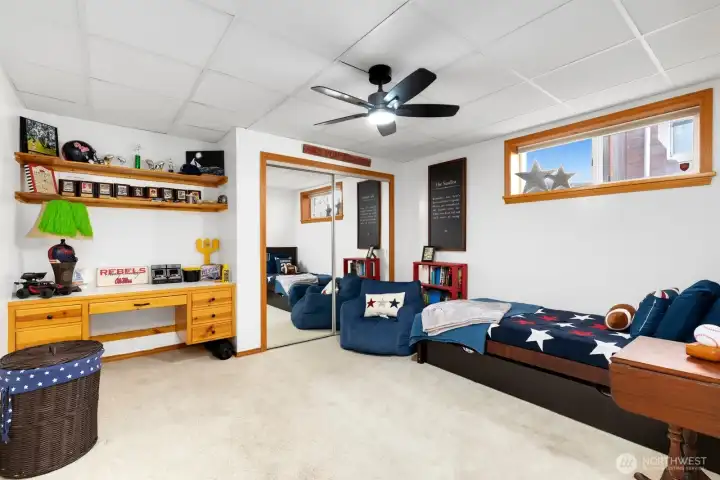 First of two lower level bedrooms, this room is ready for crafts or homework with the built-in desk. First of two lower level bedrooms, this room is ready for crafts or homework with the built-in desk.