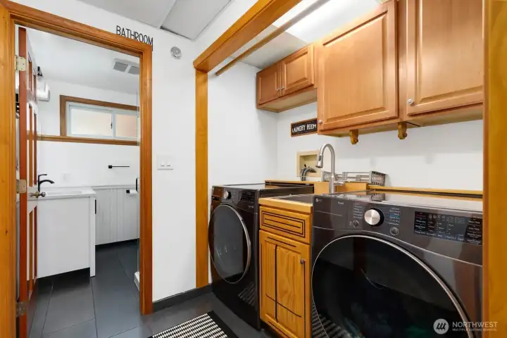Laundry station fit for a crowd. This area, as well as the bathroom beyond, has radiant heated floors. Laundry station fit for a crowd. This area, as well as the bathroom beyond, has radiant heated floors.