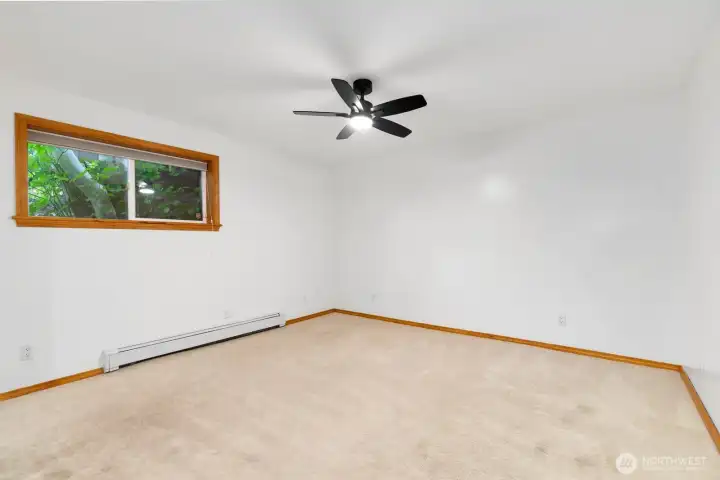 Second of two bedrooms on the lower level. Each bedroom has a ceiling fan for gentle breezes. Second of two bedrooms on the lower level. Each bedroom has a ceiling fan for gentle breezes.