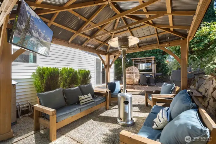 Game-day ready! Two TVs mean you can keep track of all the games at once! The gazebo and outdoor bar/kitchen structures convey with the home. Game-day ready! Two TVs mean you can keep track of all the games at once! The gazebo and outdoor bar/kitchen structures convey with the home.