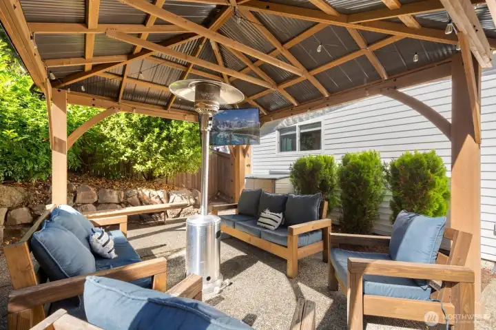 Another view of your covered outdoor lounge pergola, showing the privacy screen shrubs beyond. Another view of your covered outdoor lounge pergola, showing the privacy screen shrubs beyond.