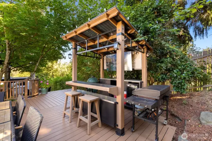 Bring your grill to complete this versatile outdoor kitchen! The beverage fridge and structure convey with the home. Bring your grill to complete this versatile outdoor kitchen! The beverage fridge and structure convey with the home.