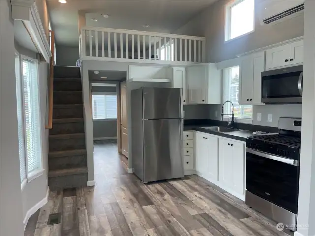 Breakfast nook on left. Hall has 3/4 bath, stack w/d area and bedroom