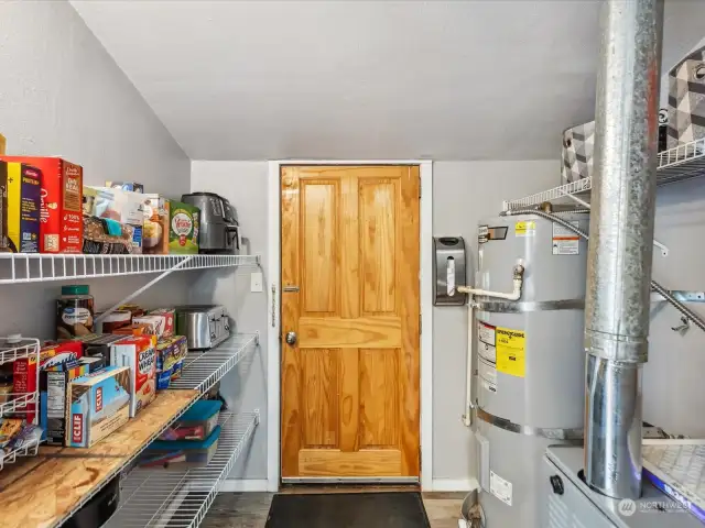 Utility room/pantry that leads to back deck.