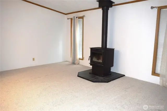 Family room with wood burning fireplace to heat the whole area