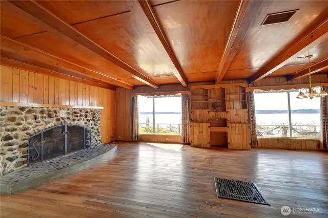 Main house large living room with rock fireplace.