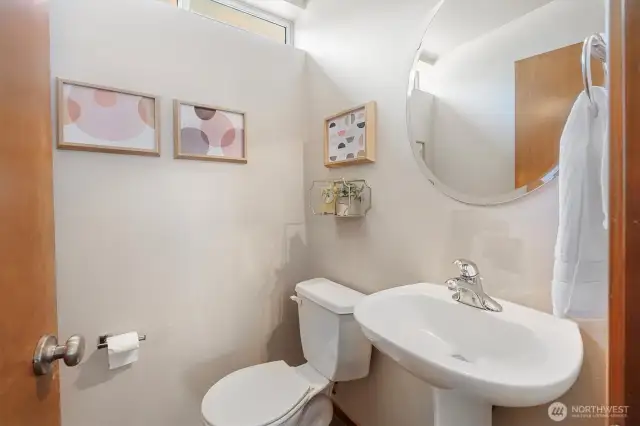 Half bath upstairs. Tall ceilings and window