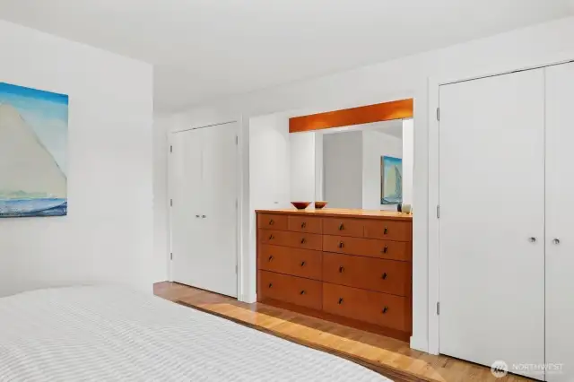 Custom built-in dresser and dual closets. En suite bath to the left in this view.