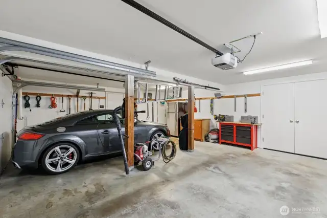 Finished garage. Double doors lead to a heated workshop/storage area.