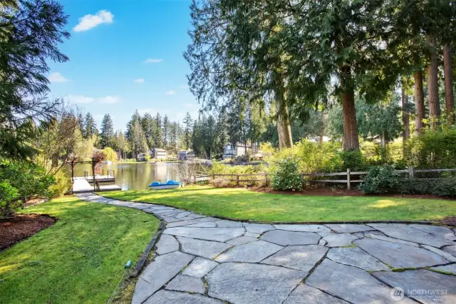 A level lawn leading to 49’ of no-bank shoreline