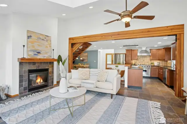 Open-concept kitchen/living area w/ a cozy gas fireplace