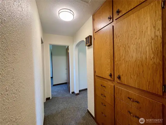 Hallway situated between 2 main level bedrooms